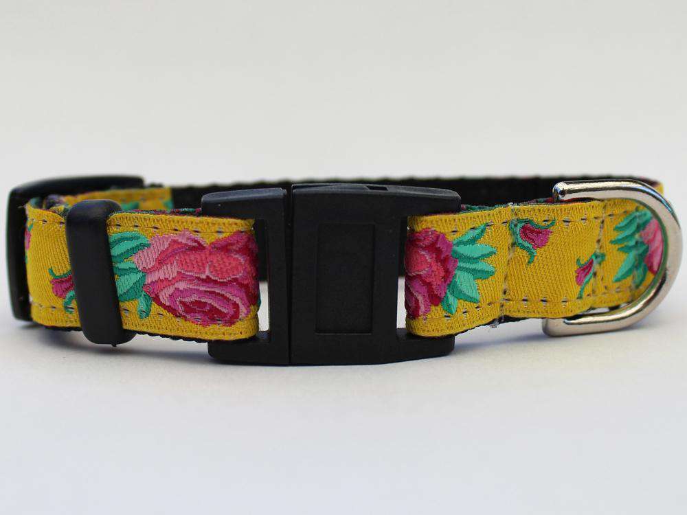 This is the Spanish Rose Design Breakaway Buckle Cat Collar by Surf Cat.   It has a red rose set against the brilliant yellow of a Sevilla Sun. It has  breakaway buckles that pop open under eight pounds of pressure. It is made of comfortable and lasting nylon overlaid with durable polyester ribbon. The quintuple stitching at specific stress points adds strength. The fabrics and stitching of the collar actively responds to your cat's actions helping the collar retain its pliable design.