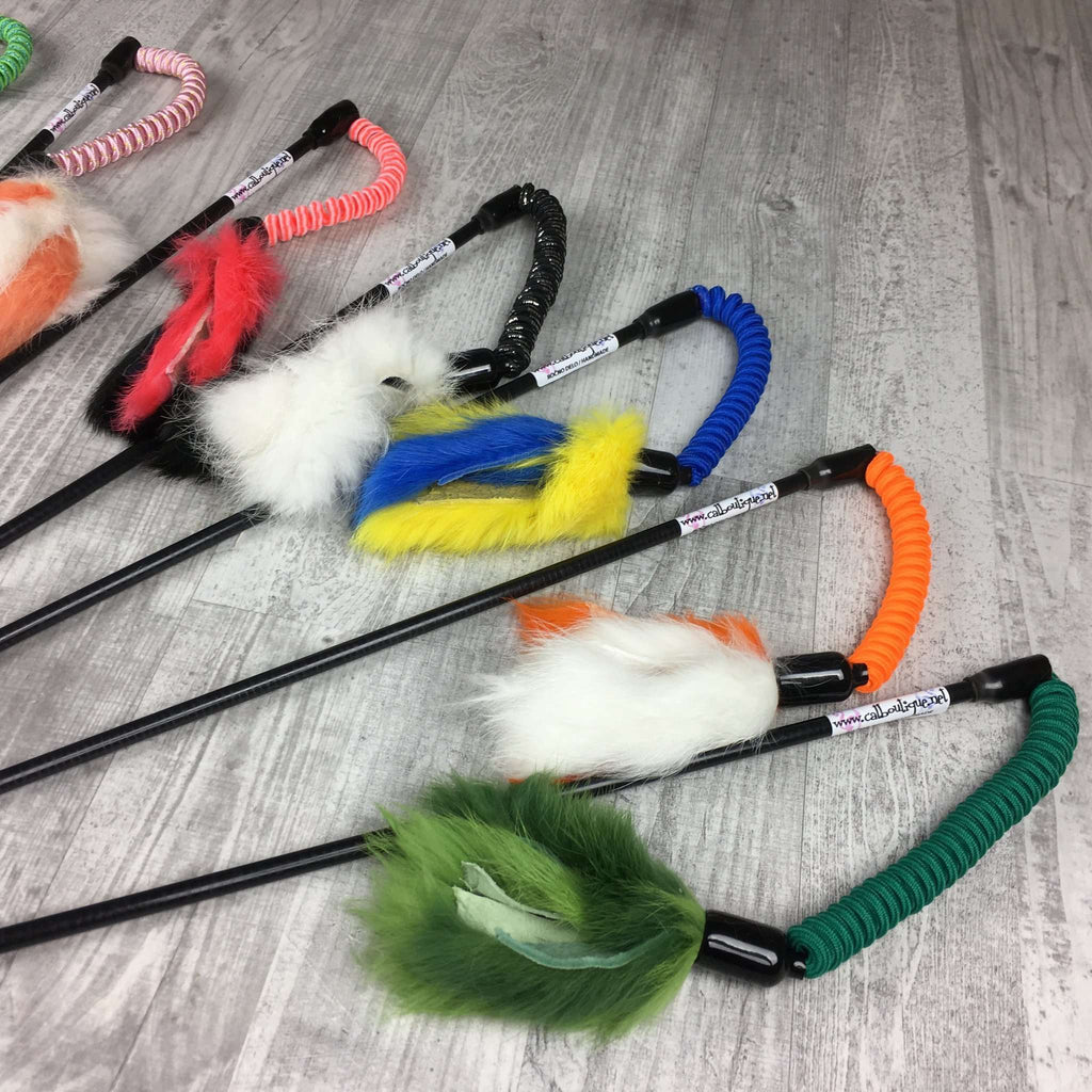 There are an assortment of Jumping Rabbit Fur Teaser Wands. The wands are made by Catboutique. They are designed to engage a cat's hunting instincts. They come in a variety of colors. 