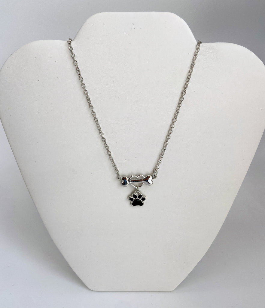 Heart Outlined Bone Pendant with Dangling Paw Print  - Artisan Jewelry