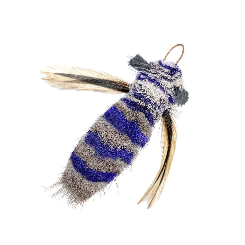 This is the Da Dragonfly™ Teaser Wand Cat Toy Replacement Lure by Go Cat. The head is white and blue striped, while the body is gray and blue striped. There are grey bristled hairs for eyes. The dragonfly has tannish and gray dark wings. A cotter clip ring is located at the head's tip. The lure works best with one of the Go Cat Teaser Wand Cat Toys.