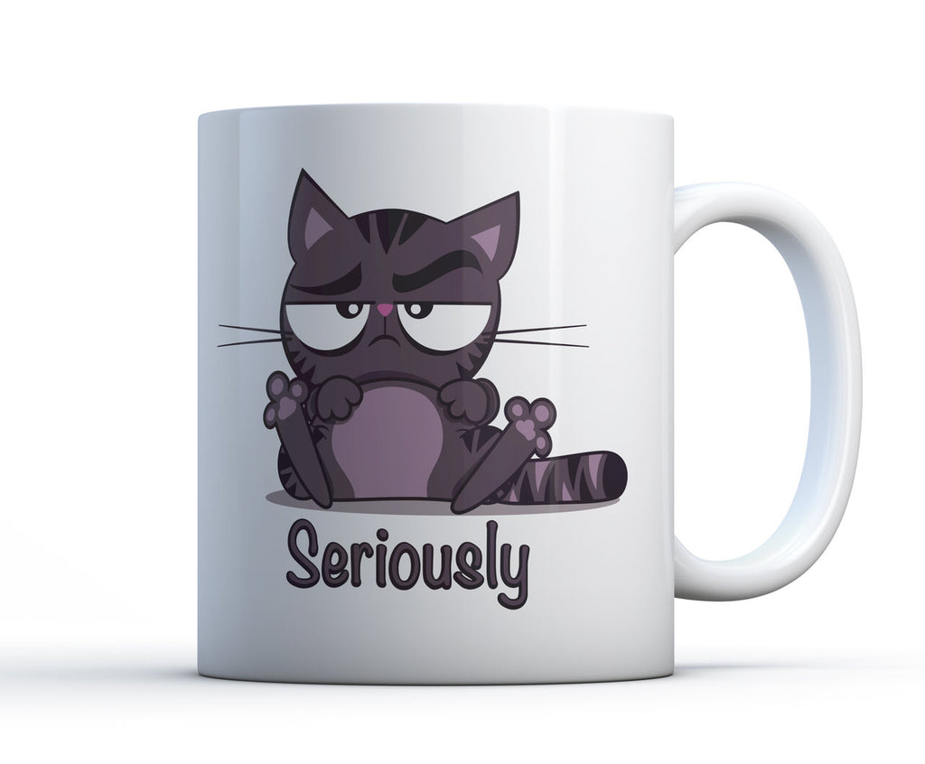 White ceramic coffee cup with grumpy grey tabby cat with raised eyebrow saying "seriously" 