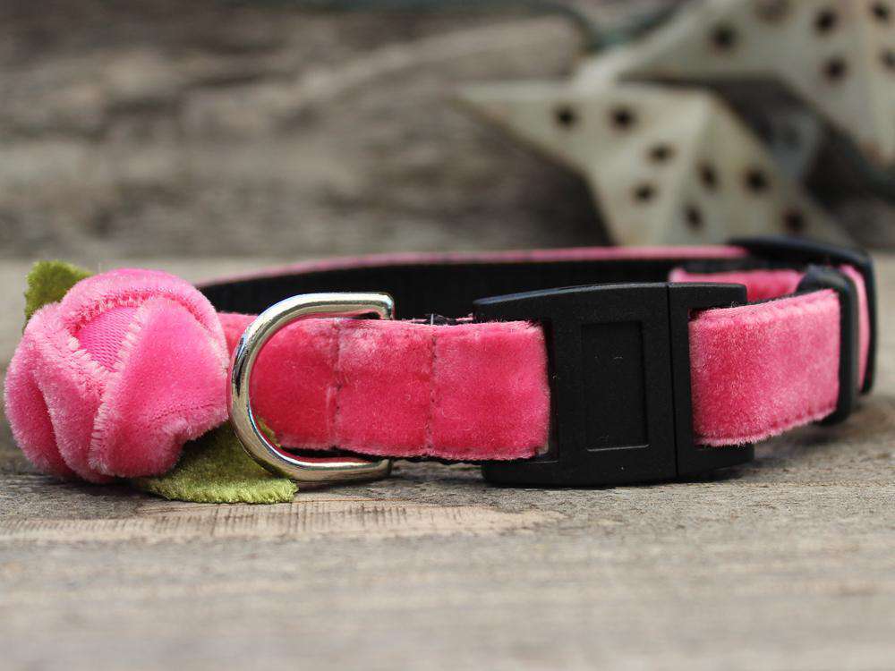 This is the Rosebud Pink Velvet Breakaway Buckle Cat Collar. It is a cat collar with a pink velvet rose on it, which the rose does come in red too. The rose has two small green fabric leaves too. The collar has breakaway buckles that pop open with eight pounds of pull. It is made of soft and comfortable nylon overlaid with durable polyester ribbon. It is quintuple stitched at stress points for added strength.