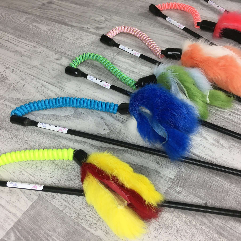 There are an assortment of Jumping Rabbit Fur Teaser Wands. The wands are made by Catboutique. They are designed to engage a cat's hunting instincts. They come in a variety of colors. 