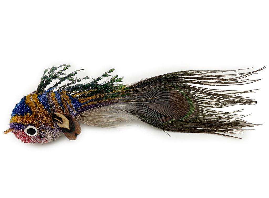 This is a Pretty Fly Fish Teaser Wand Cat Toy Replacement Lure by Catboutique. The fish is made from deer hair, and it has a peacock eye feather for a tail. The fish has feathers for fins and dorsal fin. There is a ringlet where the fish's mouth should be. The fish is turquoise, gold, purple, and pink. This lure is meant to engage at the cat's hunting instincts like prowling, pawing, and pouncing.  