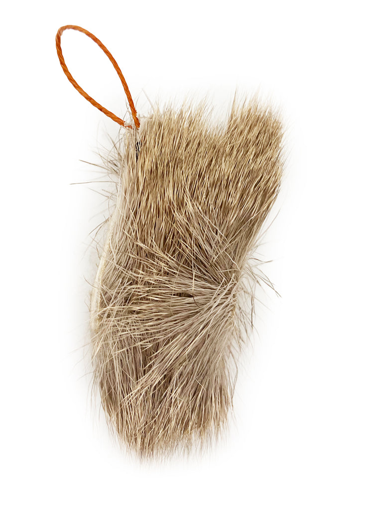 This is the Da Fur Frenzy Teaser Wand Cat Toy Replacement Lure by Go Cat. The lure's fur mimics real rabbit fur. The colors range from tan to light brown. There is a cotter clip ring at one end of the lure. This lure is meant to engage at the cat's hunting instincts like prowling, pawing, and pouncing. The lure works best with a Go Cat Teaser Wand Cat Toy.
