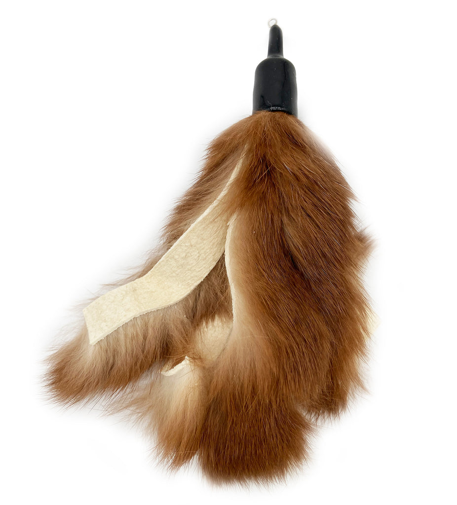 This is the Rabbit Fur Teaser Wand Cat Toy Replacement Lure by Catboutique. It is a lure made out of real rabbit fur that came from the food industry's left overs. It's about eight inches long and has four separate strands of rabbit fur on the lure. The lure attaches to any wand that has a cotter clip on the end. The toy is meant to engage a cat's instincts like pawing, pouncing, and leaping. 