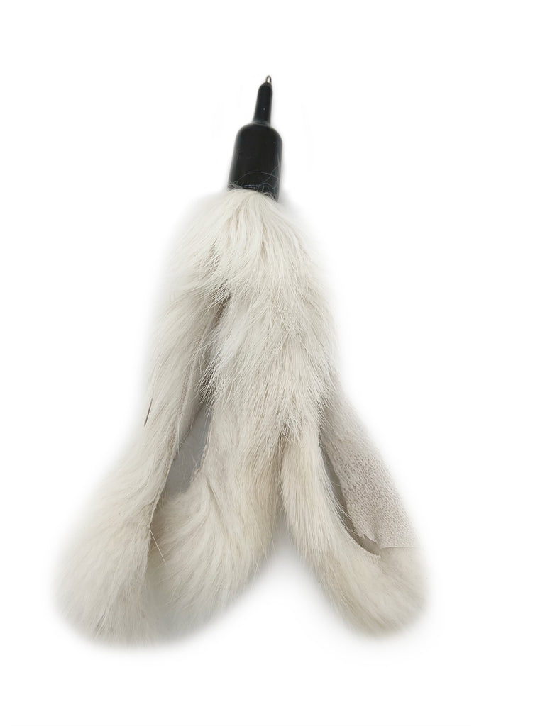 This is the Rabbit Fur Teaser Wand Cat Toy Replacement Lure by Catboutique. The rabbit fur is white. It is a lure made out of real rabbit fur that came from the food industry's left overs. It's about eight inches long and has four separate strands of rabbit fur on the lure. The lure attaches to any wand that has a cotter clip on the end. The toy is meant to engage a cat's instincts like pawing, pouncing, and leaping.