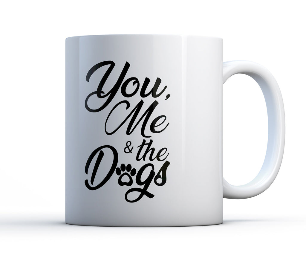 11oz or 15oz ceramic coffee mug with pawprint and the words "You, Me and The Dogs".